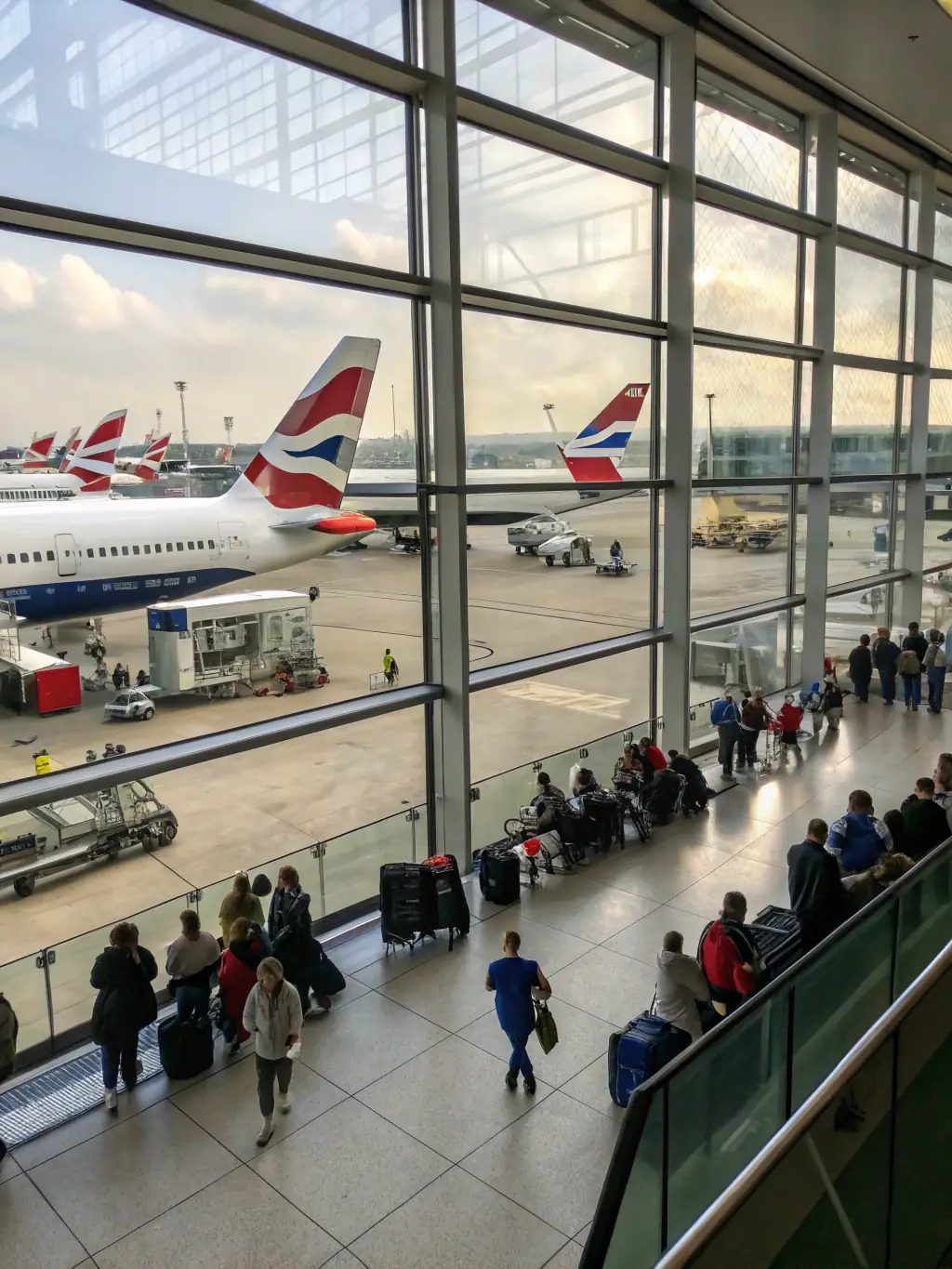 A clear photograph of the Birmingham Airport terminal, showcasing the arrival point for international visitors attending the tech expo.